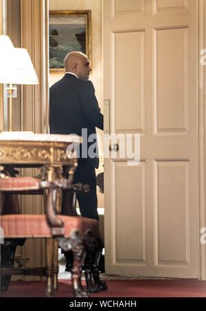 Chancellor of the Exchequer Sajid Javid is seen through the door of 11 Downing Street, London. Stock Photo