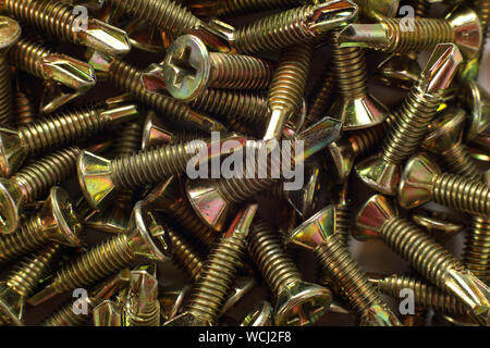 Construction, repair, tools - Abstract Self-tapping screw background Stock Photo