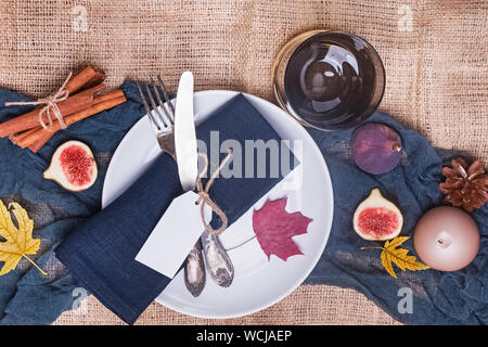 Table decorated with autumn fruits, leaves and spices. Thanksgiving day table setting, top view Stock Photo