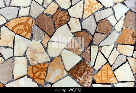Decorative panel of various parts of ceramic tiles. Stock Photo