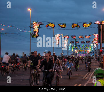 'Ride the Lights' family cycling event on the Promenade in Blackpool, UK. Road is closed to cars for its 5 mile length of the Illuminations. Stock Photo