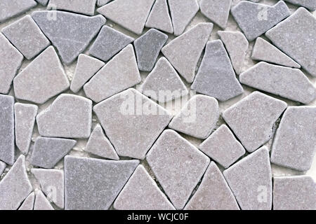 Porcelain stonewear tiles of gray stones. Background from gray stones. Stock Photo