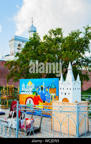 Veliky Novgorod,Russia-August 10, 2019. Belfry of St Sophia cathedral various touristic entertainment equipment on the foreground in Veliky Novgorod, Stock Photo
