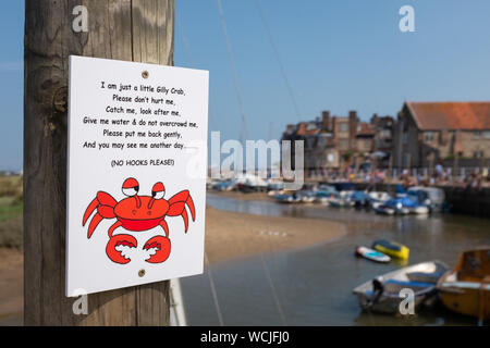 crabbing sign, nailed to wooden post in Blakeney, Norfolk, England, UK Stock Photo