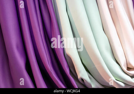 Satin fabric in the shop window. Texture of satin fabri?. Stock Photo