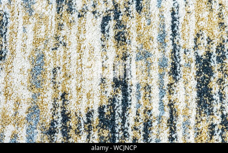 Texture of the carpet with an abstract pattern. ?arpet background with multi-colored stripes. Stock Photo