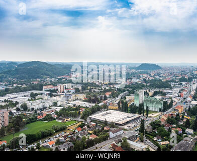 Aerial view of city Graz from helicopter drone with district Gösting and hill Schloßberg on a sunny summer day in Austria, Europe Stock Photo