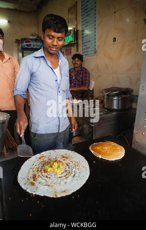 India, Telengana, Hyderabad, Man cooking a masala dosa. Stock Photo