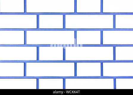 Texture of white brick wall. Background of white brick with blue seams. Stock Photo