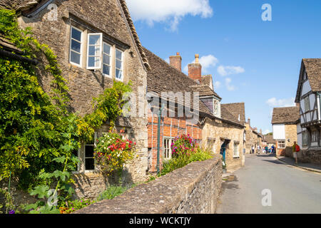 Old pretty stone houses in Lacock village centre Wiltshire england uk gb Europe Stock Photo