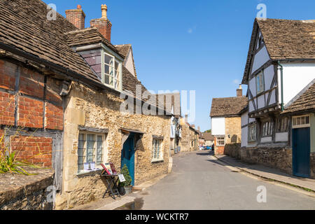 Old pretty stone houses and half timbered buildings in the old historic village centre of Lacock village Wiltshire england uk gb Europe