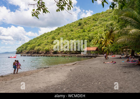 Anse Noire, Martinique, FR: 13 August 2019: Top view of Anse Noire beach. This cove gets its name from the volcanic origin of its sand. Stock Photo