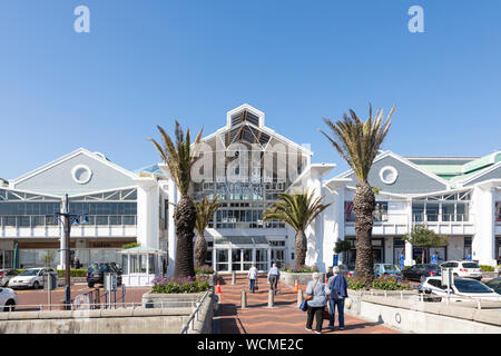 Elderly couples entering the Victoria Wharf Shopping Centre at the V and A Waterfront, Cape Town, Western Cape, South Africa Stock Photo