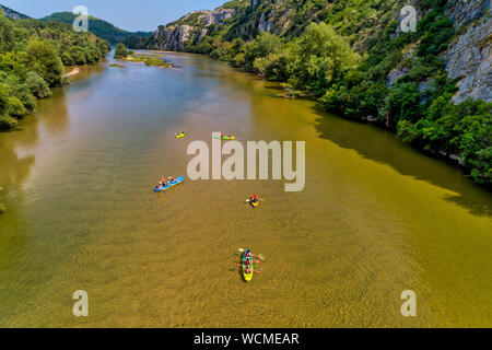 Aerial view of adventure team doing Kayaks on the cold waters of the Nestos River in Toxotes, Xanthi, Greece. Nestos river is one of the most popular Stock Photo