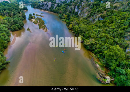 Aerial view of adventure team doing Kayaks on the cold waters of the Nestos River in Toxotes, Xanthi, Greece. Nestos river is one of the most popular Stock Photo