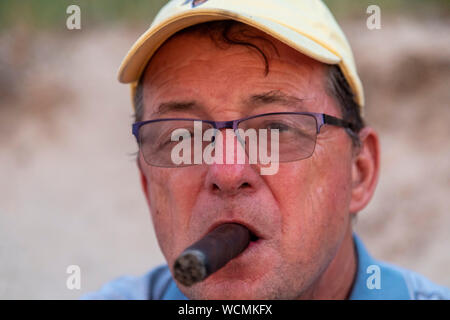 Union Pier, Michigan - A man smoking a cigar. Stock Photo