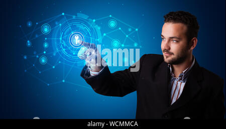 Man touching hologram screen displaying keys and locks Stock Photo