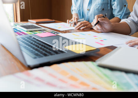business technology concept, creative team designer choosing samples with UI/UX developing on sketch layout design mockup on smartphone application fo Stock Photo