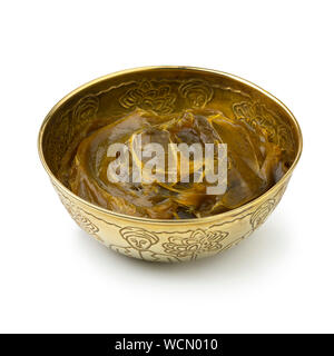 Savon beldi in a decorated metal cup isolated on white background Stock Photo