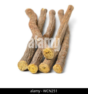 Heap of  Licorice roots isolated on white background Stock Photo