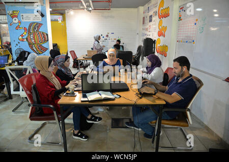 (190828) -- GAZA, Aug. 28, 2019 (Xinhua) -- Palestinian youths work inside Gaza Sky Geeks, one of several local innovation hubs in the Gaza Strip, on Aug. 26, 2019. Hundreds of small business ideas come up in the West Bank and Gaza Strip, but only a small number of them flourishes and continues due to the limitations in the supporting eco-system for the start-ups. TO GO WITH 'Feature: Palestinian start-ups see limited growth' (Str/Xinhua) Stock Photo