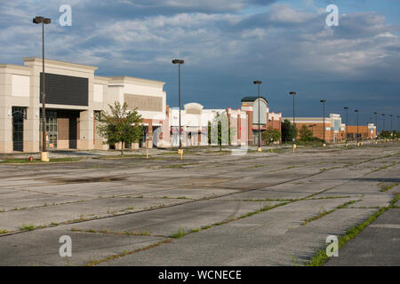 A row of closed and abandoned retail stores in a deserted shopping center in Garfield Heights, Ohio on August 12, 2019 Stock Photo