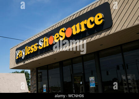 A logo sign outside of a closed Payless ShoeSource retail store location in Youngstown, Ohio on August 12, 2019. Stock Photo