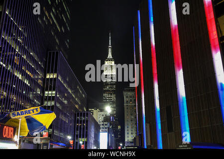 NEW YORK, NY - NOVEMBER 05:  Evening lights with Empire State building view from street near Madison Square Garden in New York City. Stock Photo