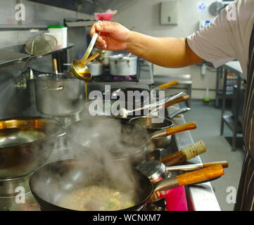 Chef working in restaurant kitchen Stock Photo