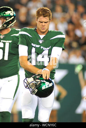 New York Jets quarterback Sam Darnold stands on the sidelines in the ...