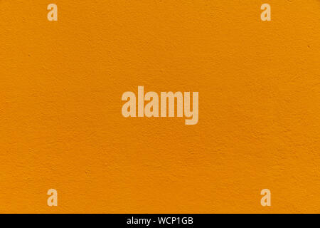 Orange Textured Rendered Wall - Stucco / Fresco effect with small ripples and chips Stock Photo