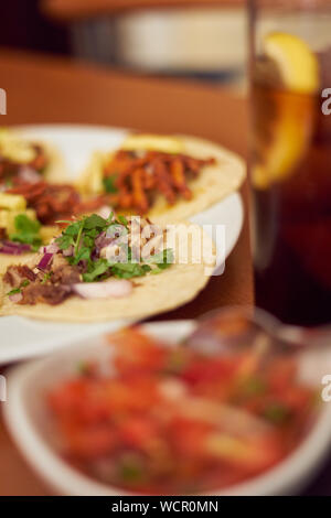 Mexican Tacos 'Pastor' and 'Carnitas' with pork and beef in yellow tortilla Stock Photo