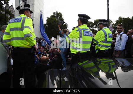Protesters stop traffic outside the Houses of Parliament, London, as they demonstrate against Prime Minister Boris Johnson temporarily closing down the Commons from the second week of September until October 14 when there will be a Queen's Speech to open a new session of Parliament. Stock Photo