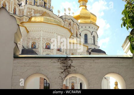 Orthodox Christian monastery. Golden domes of cathedrals and churches, Kiev-Pechersk Lavra Monastery, blue sky. Historic cultural sanctuary. Pechersk Stock Photo