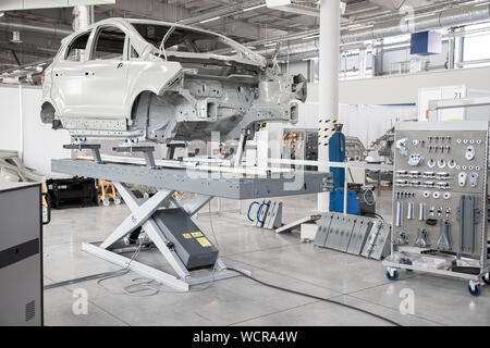 Car frame in a car manufacturing workshop. Collector Tools. Auto repair shop. Stock Photo