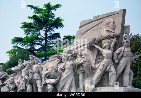 A memorial statue to the peoples heroes in tiananmen square beijing china during the day. Stock Photo