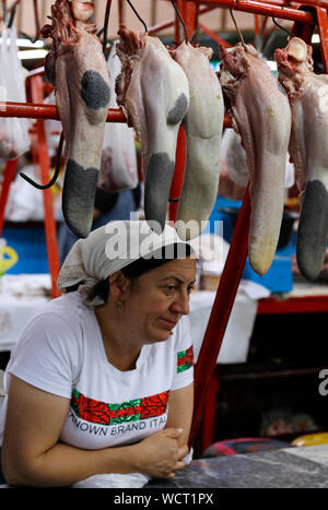 Almaty, Kazakhstan - August 22, 2019: People in the meat section of the famous Green Bazaar of Almaty, Kazakhstan. Stock Photo