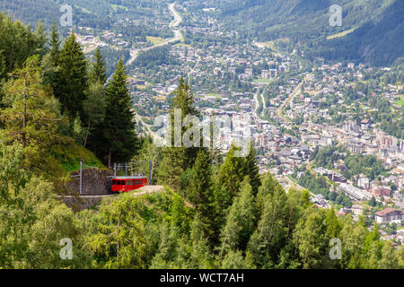 Mountain railway that leads to the Mer de Glace glacier, with panoramic views of Chamonix in the background Stock Photo