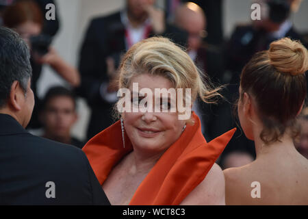 VENICE, Italy. 28th Aug, 2019. Catherine Deneuve walks the red carpet ahead of the opening ceremony during the 76th Venice Film Festival at Sala Casino on August 28, 2019 in Venice, Italy. Credit: Andrea Merola/Awakening/Alamy Live News Stock Photo