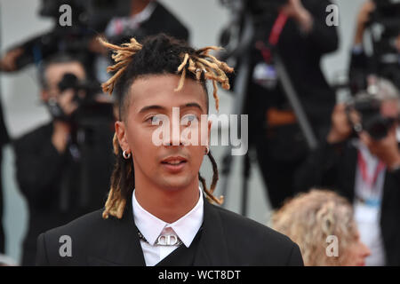 VENICE, Italy. 28th Aug, 2019. Ghali walks the red carpet ahead of the opening ceremony during the 76th Venice Film Festival at Sala Casino on August 28, 2019 in Venice, Italy. Credit: Andrea Merola/Awakening/Alamy Live News Stock Photo