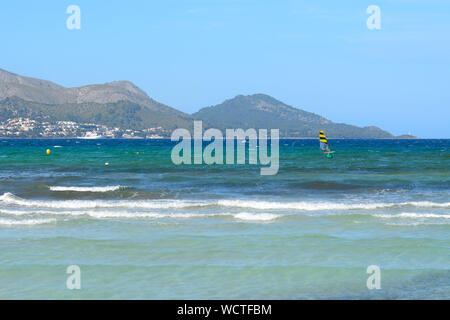 Shallow and turquoise waters of the bay of Alcudia in north part of Mallorca. Spain Stock Photo
