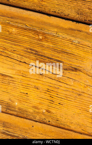 Wooden panels and boards of a rural house, Italy. Walls and ornaments in painted wood for the country house, ruined by time. Stock Photo