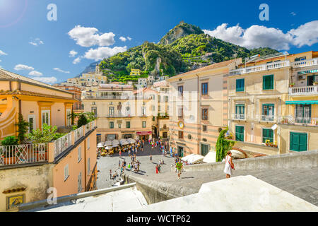 Mountain and city views from the top of the stairs of the Amalfi Cathedral on the Amalfi Coast of Italy with the hilltop Torre dello Ziro fort in view