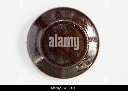 round clay probe with brown glossy glaze Stock Photo