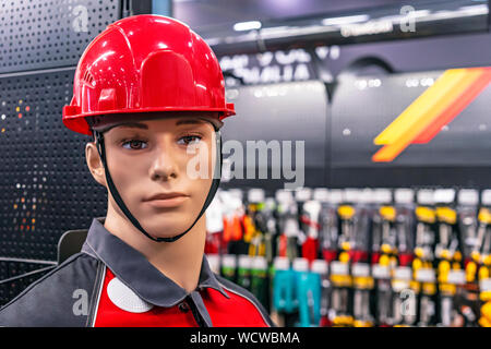 Male mannequin in a protective helmet and work clothes. Stock Photo
