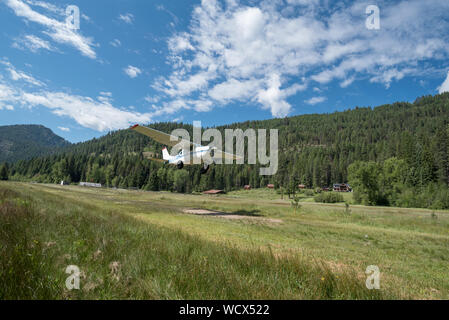 Airplane taking off from the airstrip at the Minam River Lodge in Oregon's Wallowa Mountains. Stock Photo