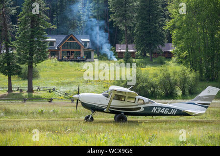 Airplane taxiing on the airstrip of the Minam River Lodge in Oregon's Wallowa Mountains. Stock Photo