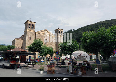 Weekly market in front of Iglesia de San Vicente, Potes, Cantabria, Spain Stock Photo
