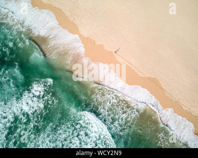 Aerial Photography of Ocean With Person Walking on Beach Stock Photo