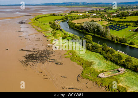 Aerial drone view of abandoned ships on the banks of the River Severn at Purton in England Stock Photo